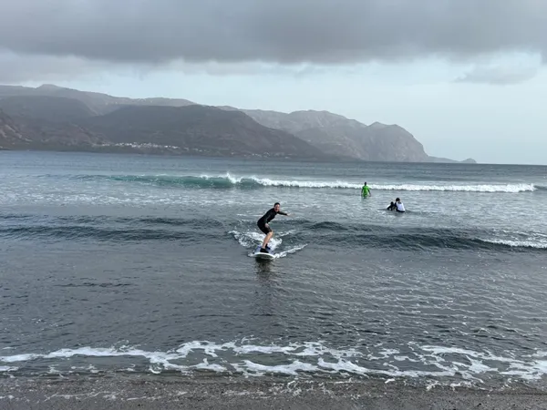 Surfer catching a wave at Tarrafal